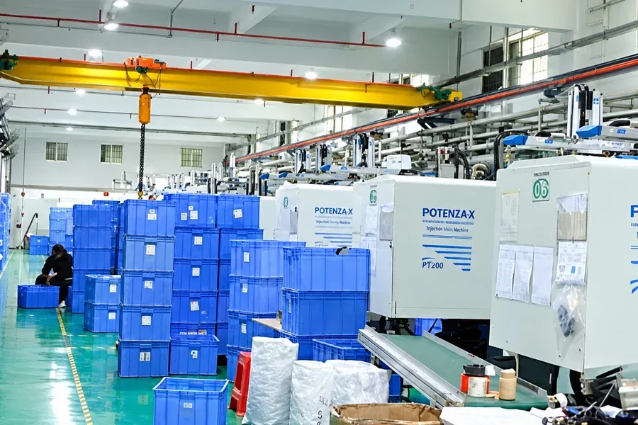 Injection molding workshop with plastic housing machines